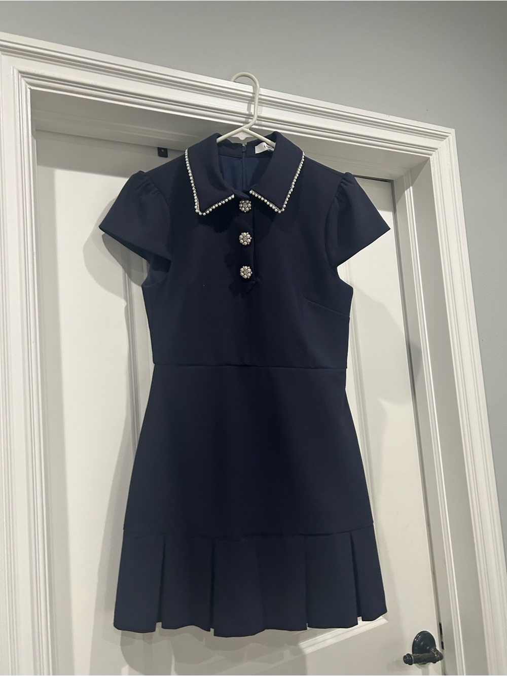 Likely Navy Dress with Pearl-Trim Collar and Jewel Buttons